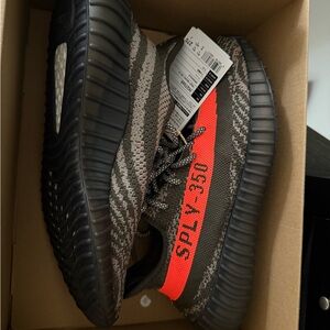 Adidas Black and Orange Athletic Shoes with Primeknit Upper